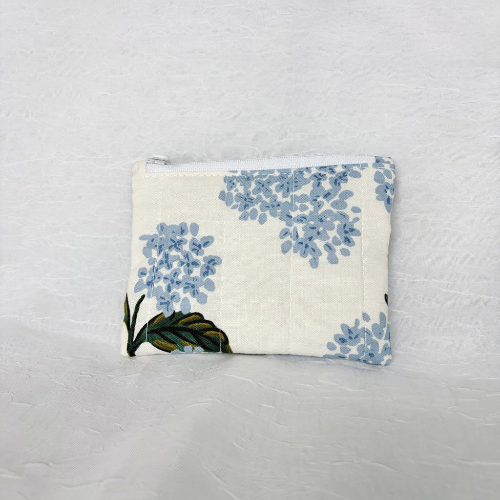 back side Blue Hydrangea with green leaf patterned Pouch with white zipper on white background