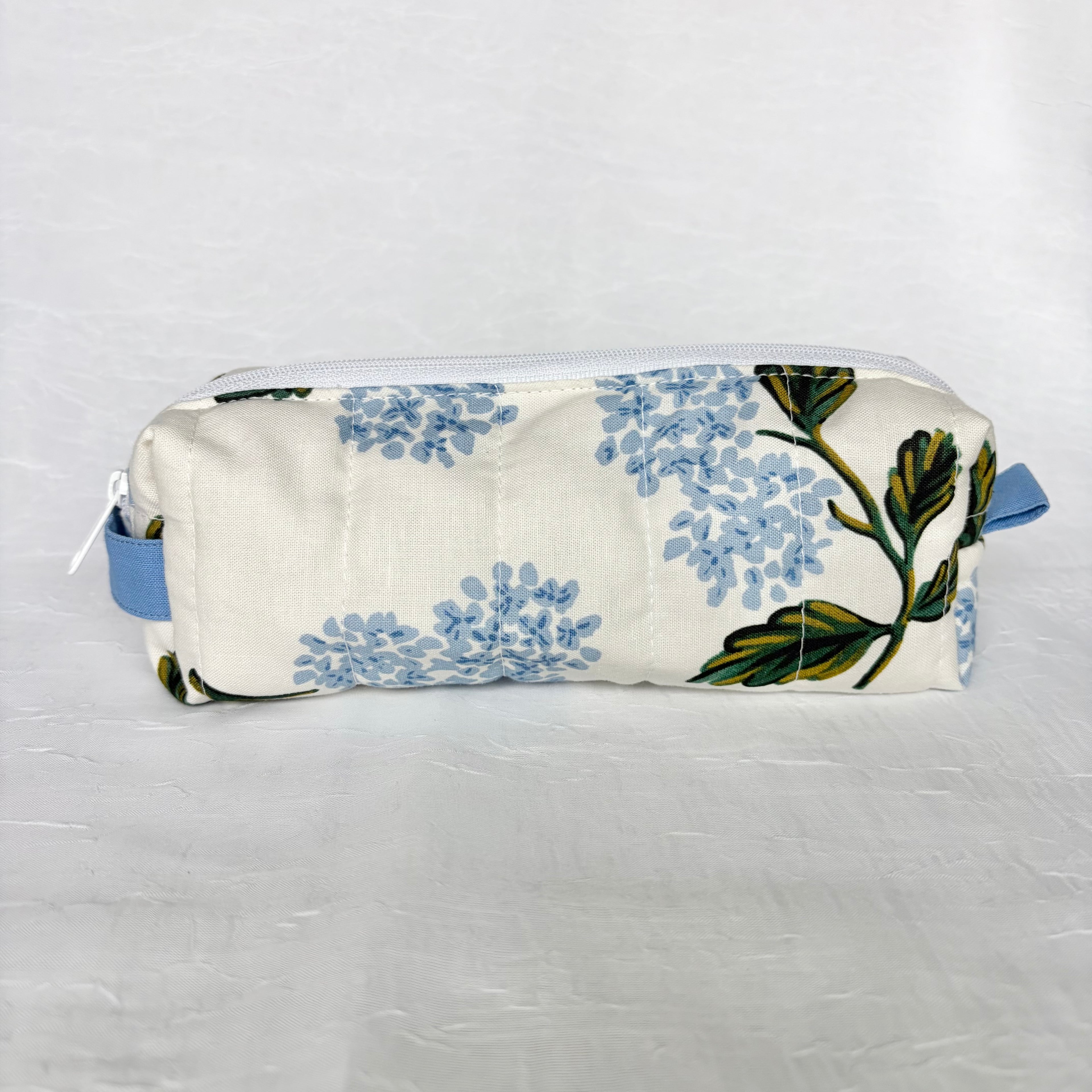 Blue Hydrangea-patterned pouch back view on white background