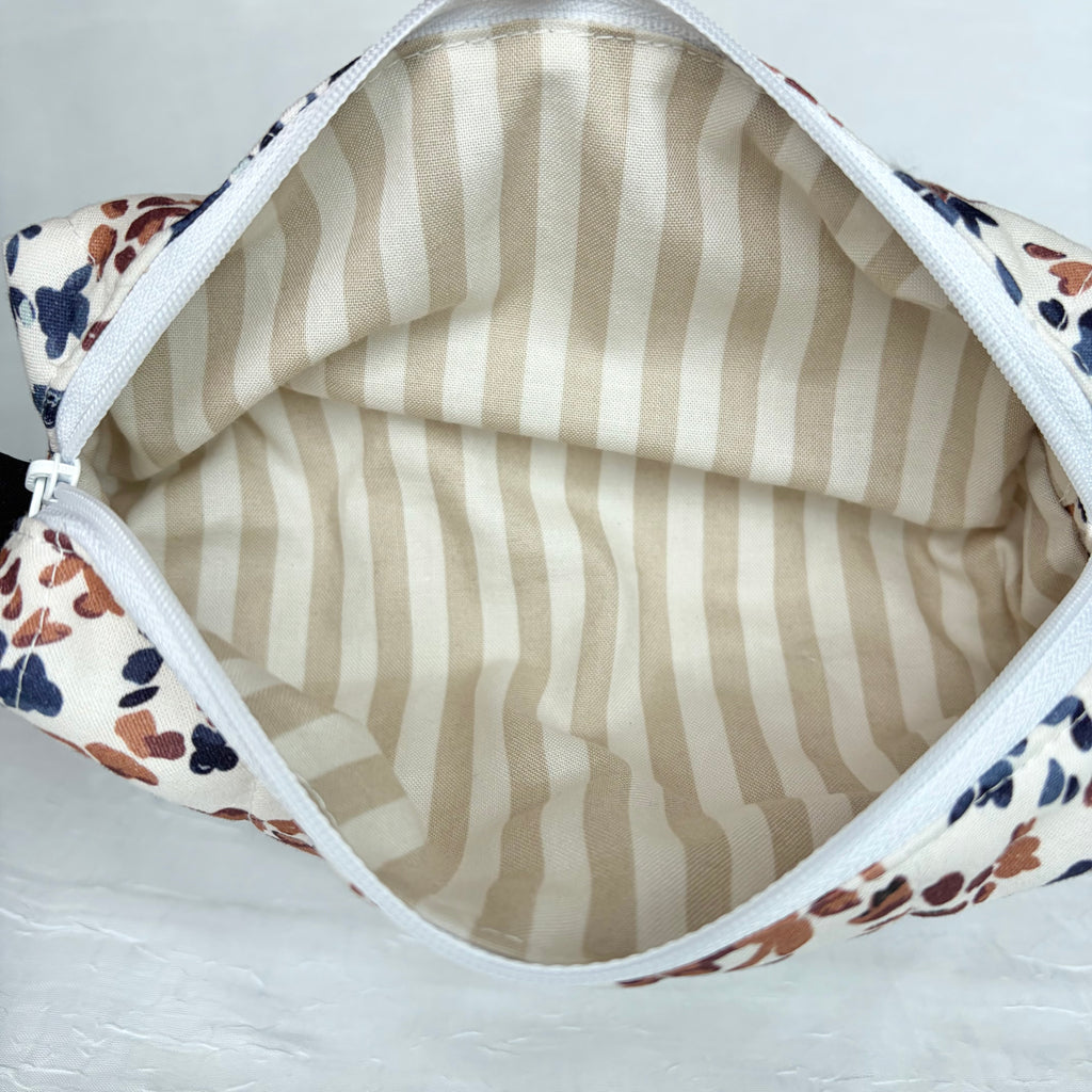 Tan and cream striped interior with white zipper