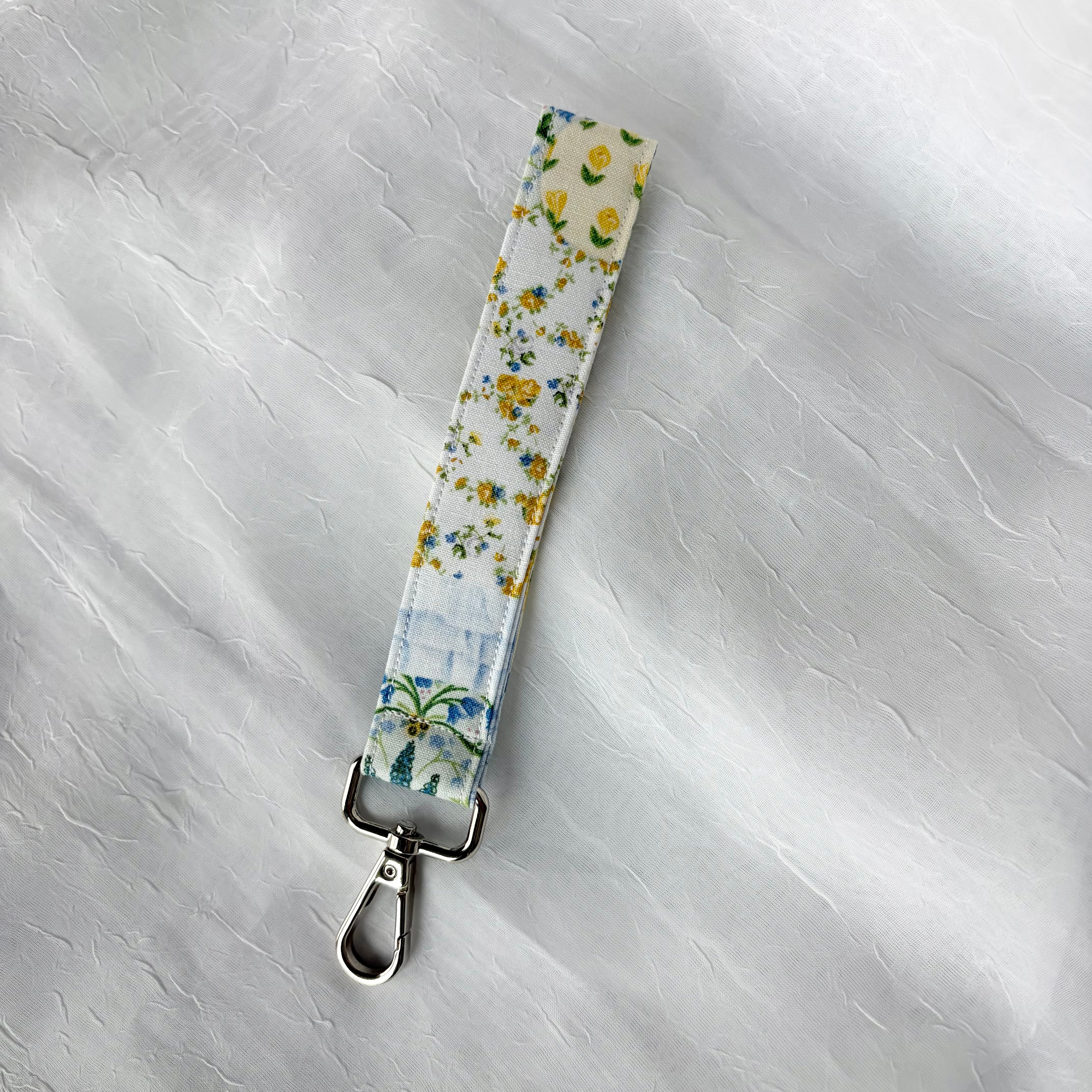 blue and yellow floral pattern keychain wristlet with silver lobster clip