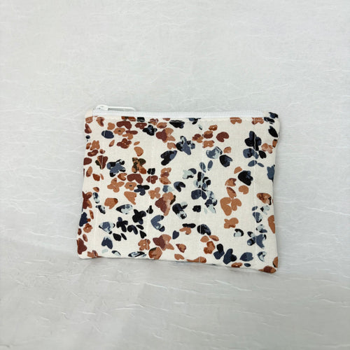 back side of Blue and Mauve speckled pouch with white zipper on white background