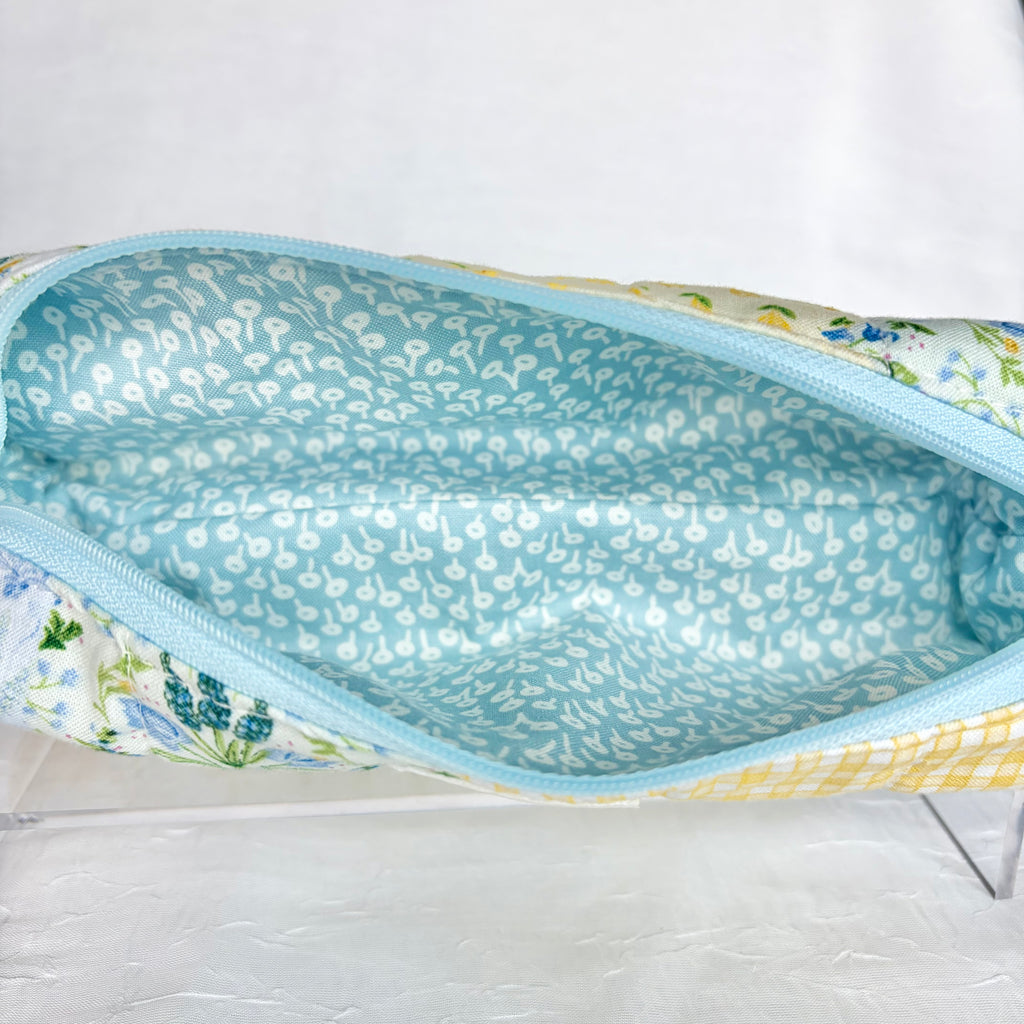 Close up of Blue liner with white flower design and light blue zipper