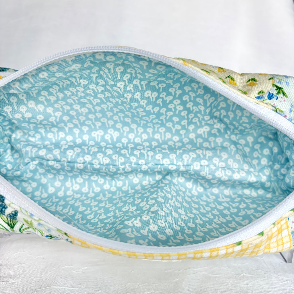 Close up of Blue liner with white flower design and white zipper
