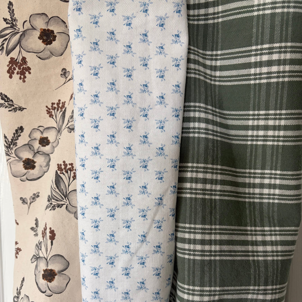 Neutral floral with grays and browns on crean, small blue flowers on white and white plaid on green
