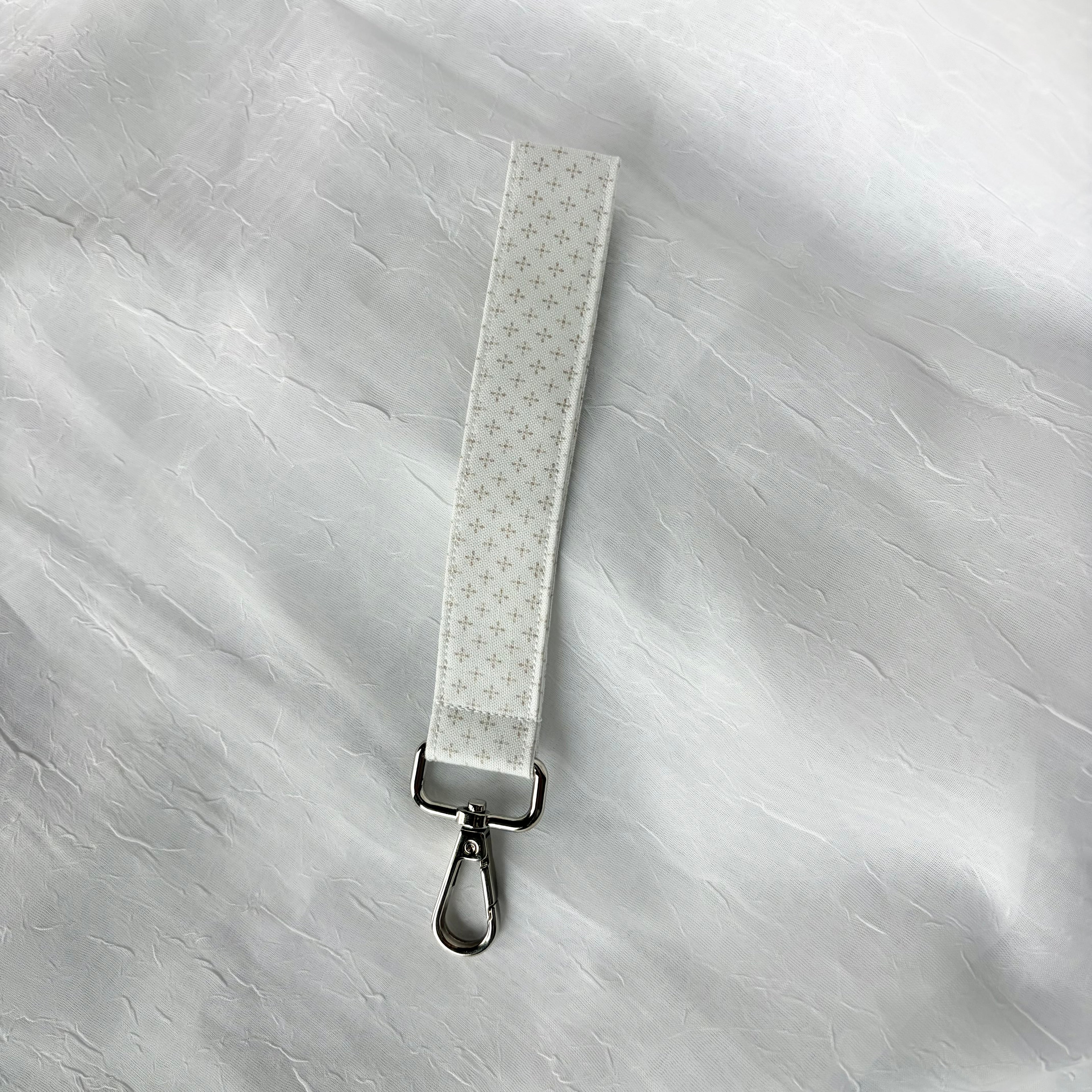 cream with brown dots in diamond pattern keychain wristlet with silver lobster clip