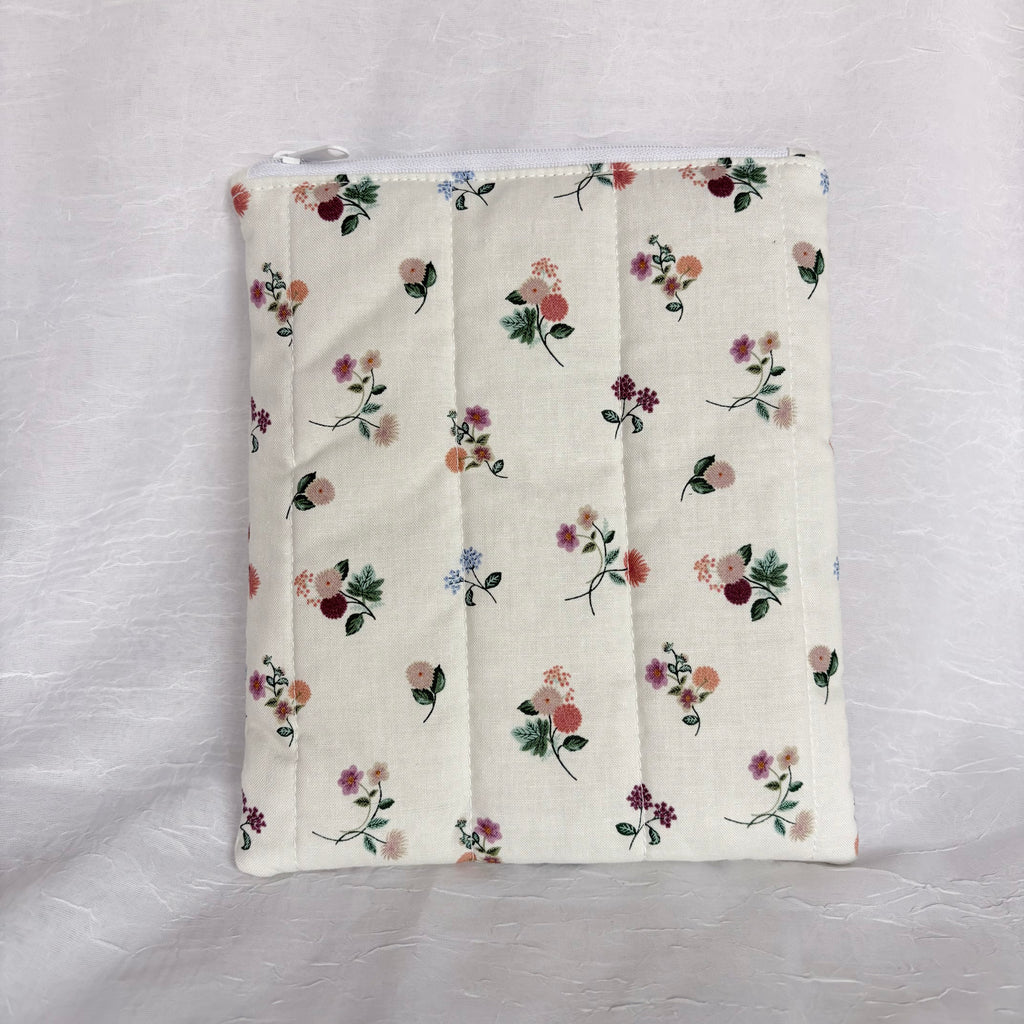 back Floral on Cream plush, flat pouch with white zipper and label on white background
