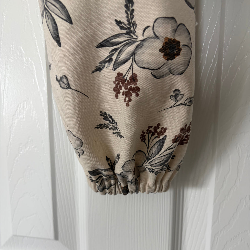 close up of bottom of neutral floral fabric that's scrunched up