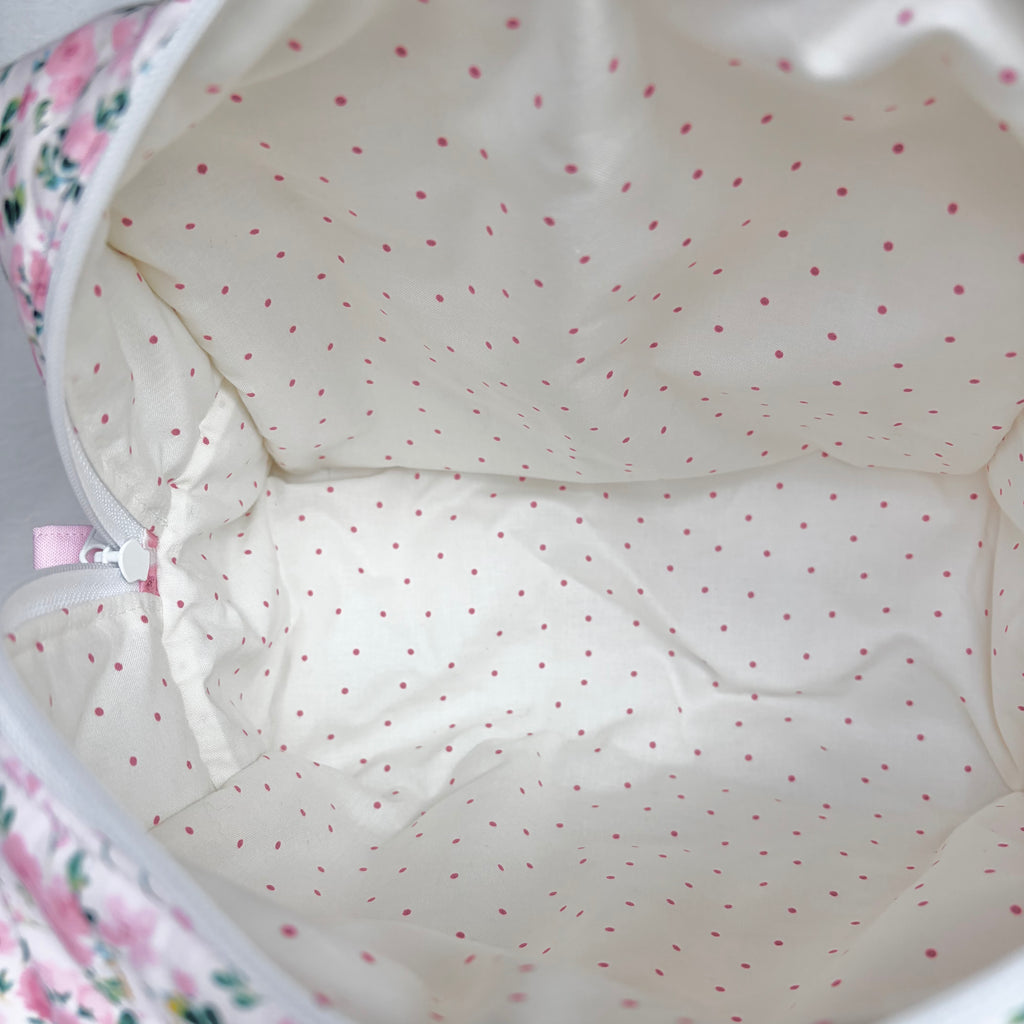 Close up of cream with pink polka dot interior