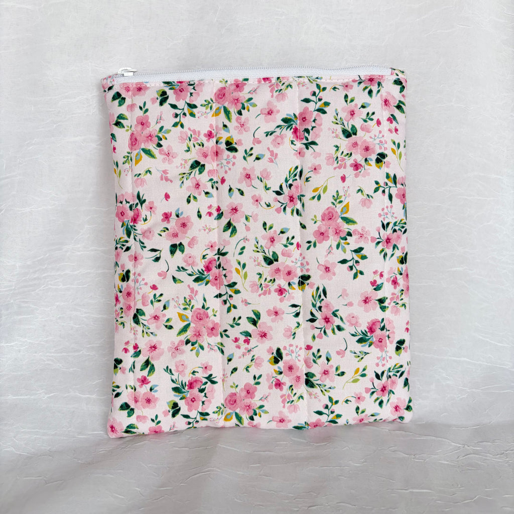 Back of Pink floral with green leaf designed flat, plush pouch with white zipper on white background