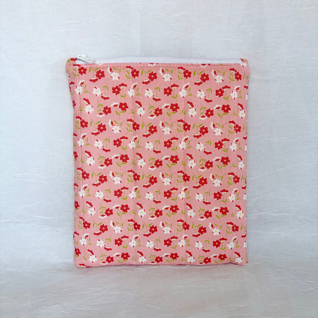 pink Floral-patterned pouch on a white background