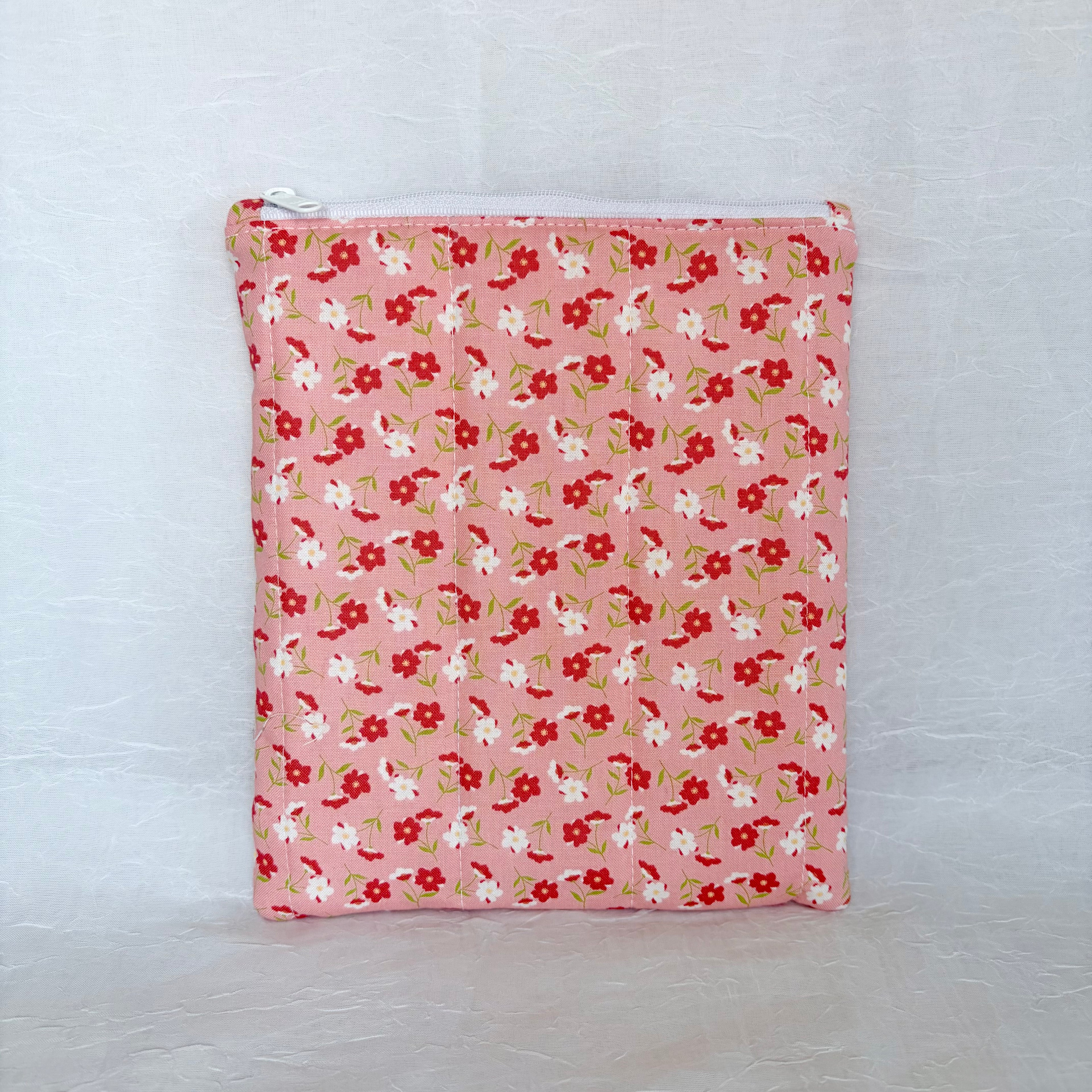 pink Floral-patterned pouch on a white background