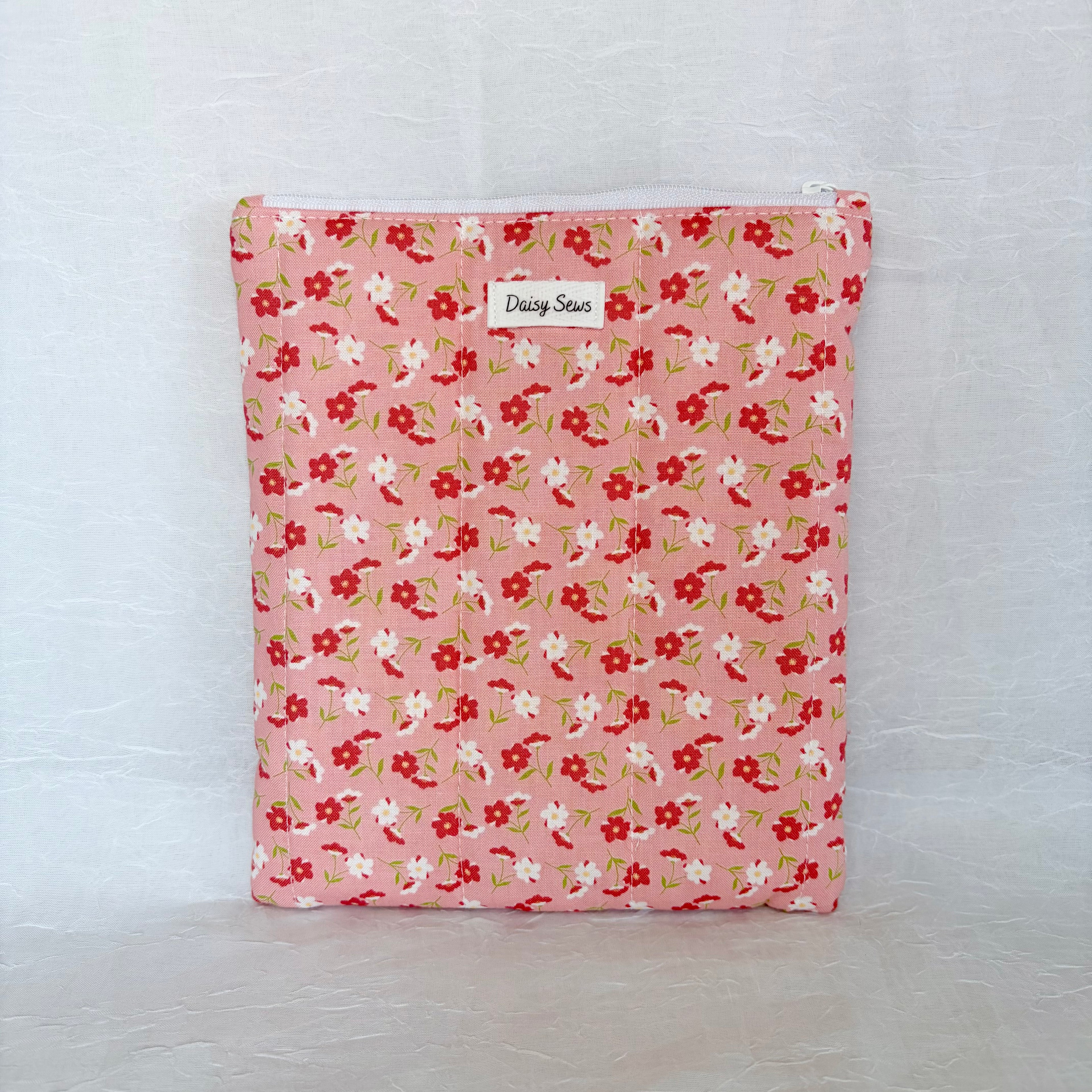Pink Floral-patterned pouch on a white background