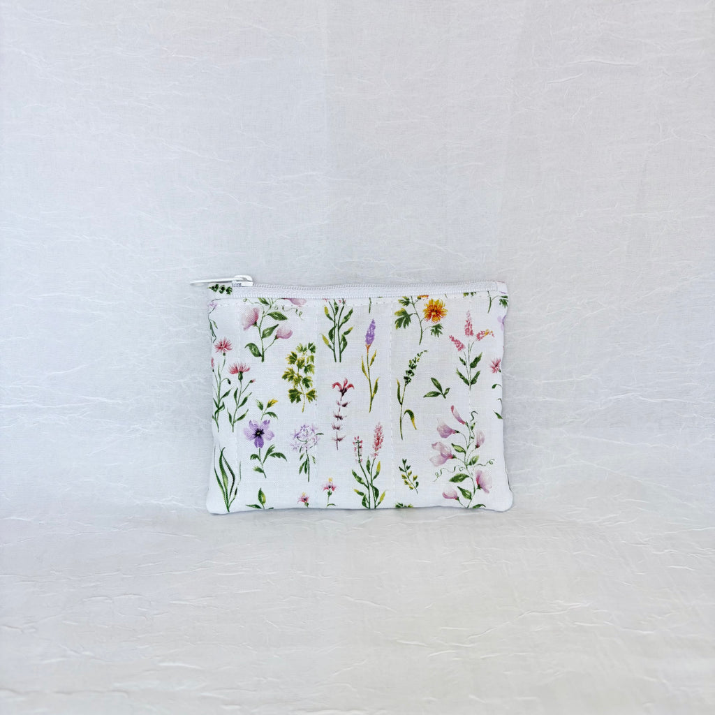 Small pouch with floral pattern on a light gray background