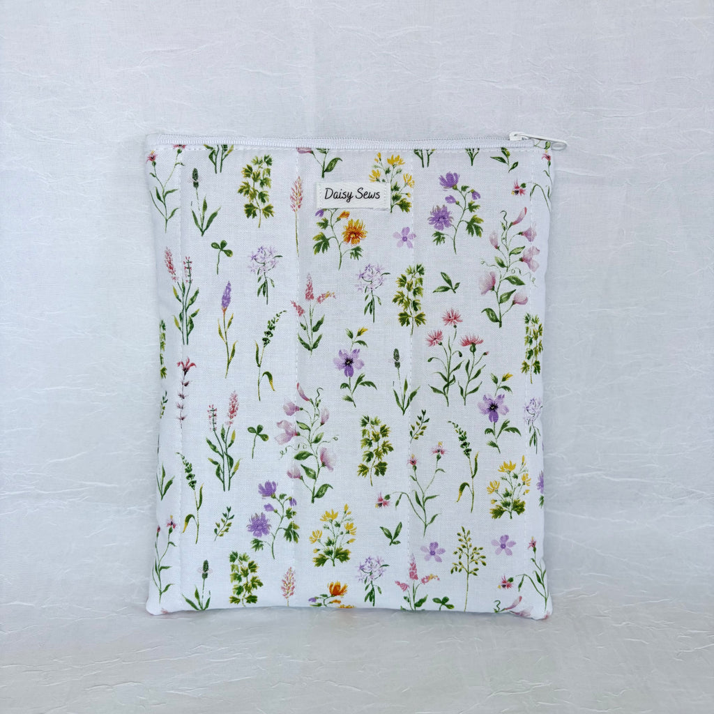 Floral-patterned pouch on a light gray background