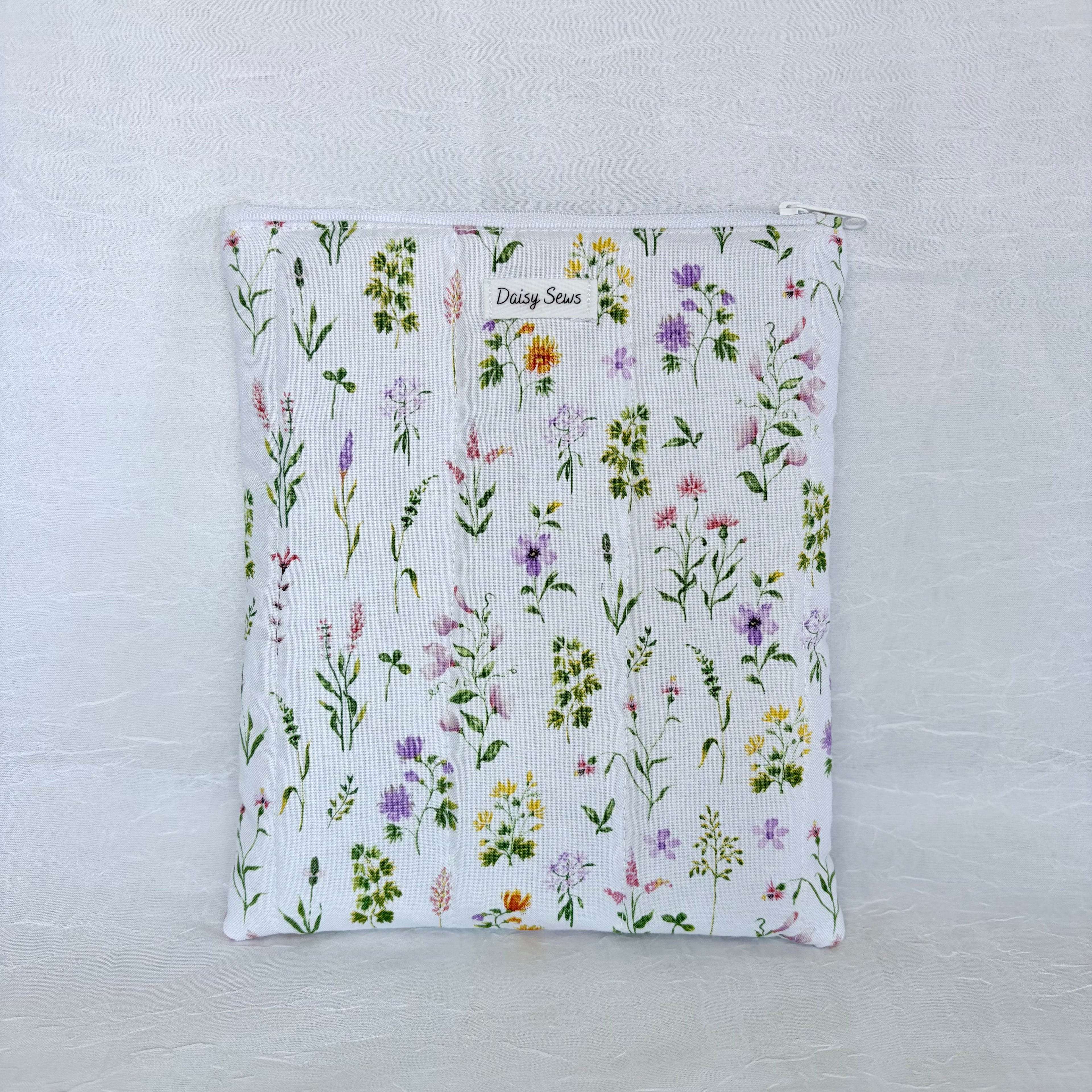 Floral-patterned pouch on a light gray background