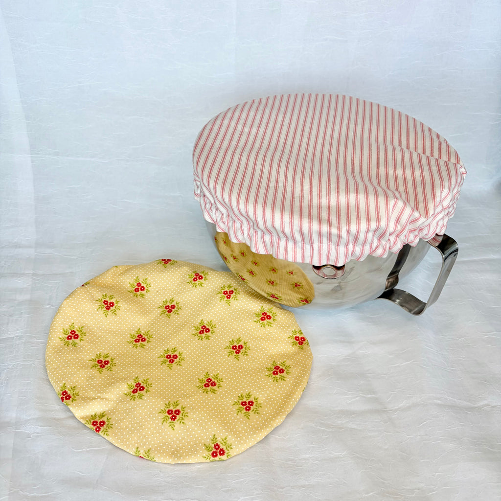 Two fabric covers, one with a red and white striped pattern and the other with a yellow floral design, on a white background.