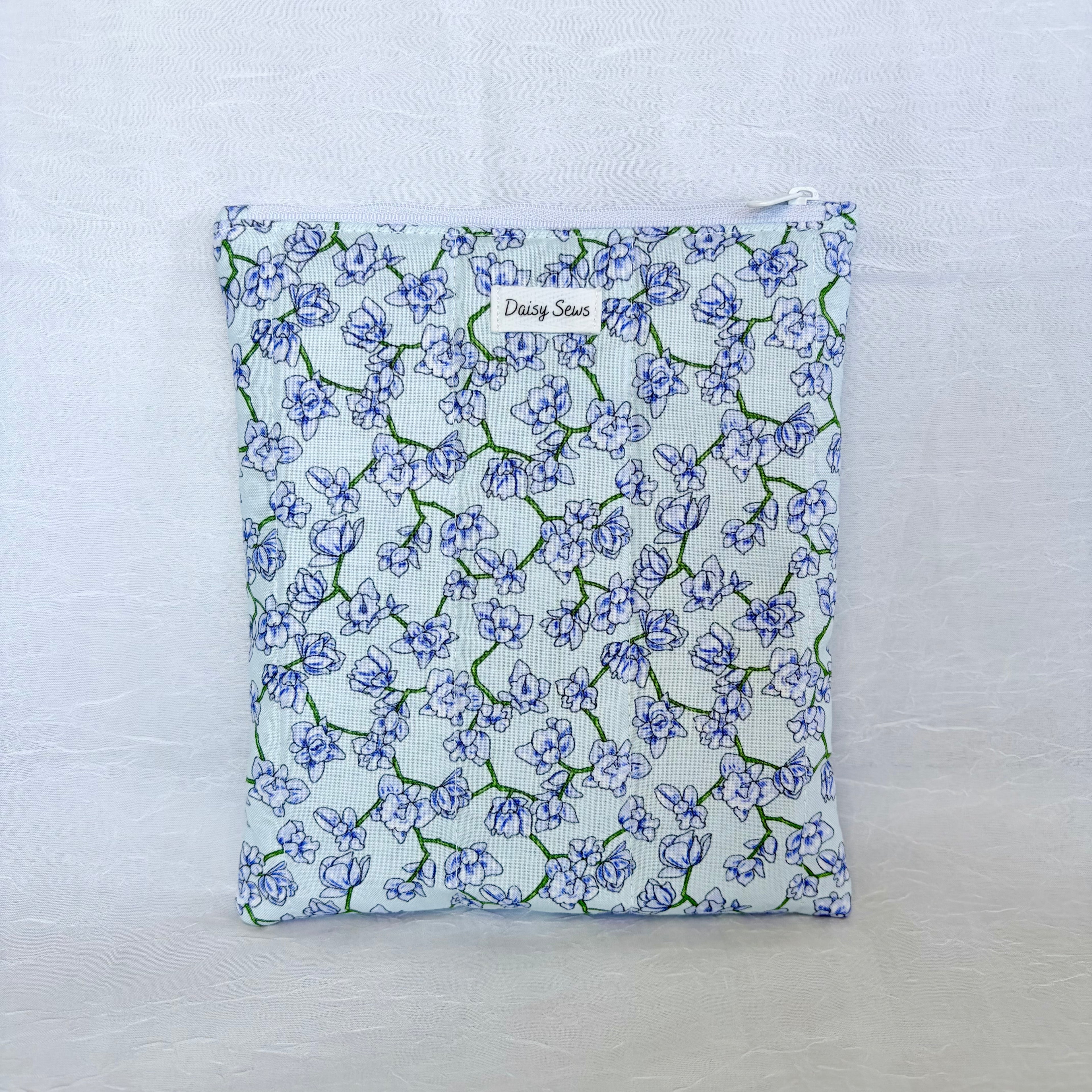 purple blue Floral-patterned fabric pouch on a white background