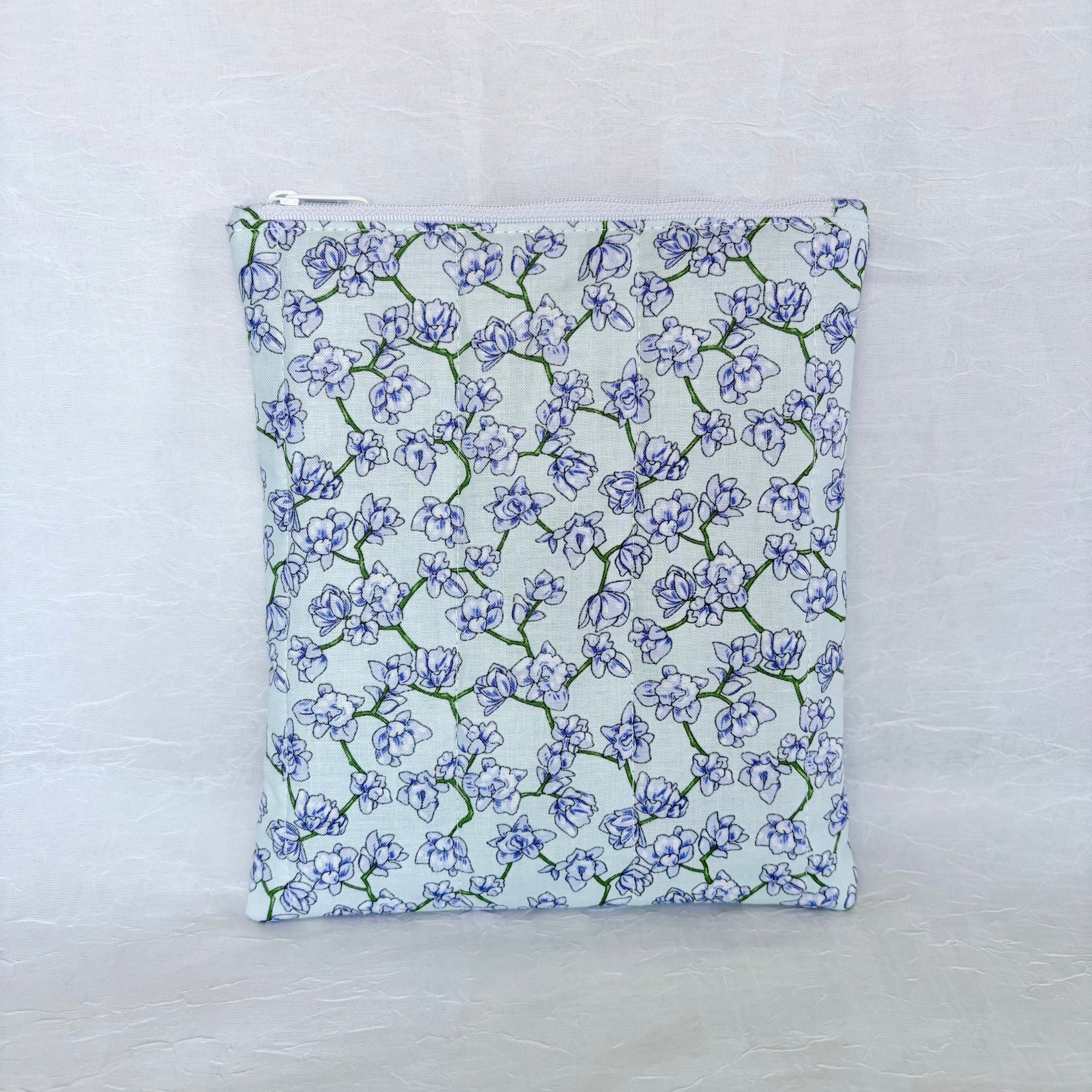 purple blue Floral-patterned pouch on a light gray background